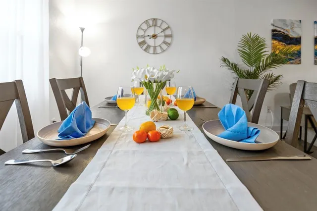 a dining room with furniture and a chandelier