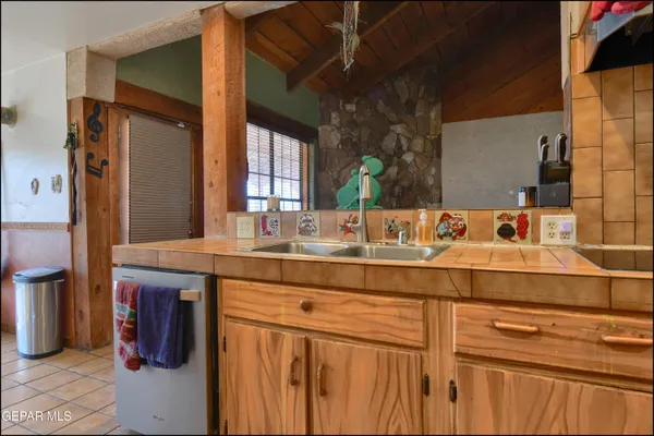a view of entryway with wooden floor and stairs