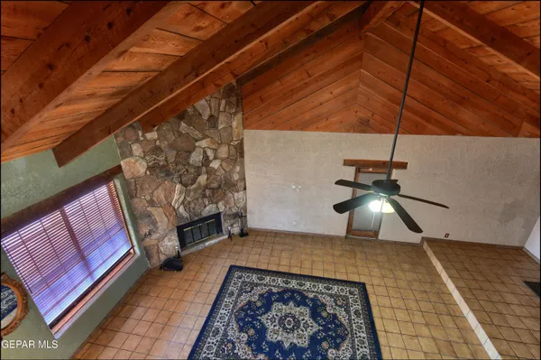 a living room with furniture and gym equipment