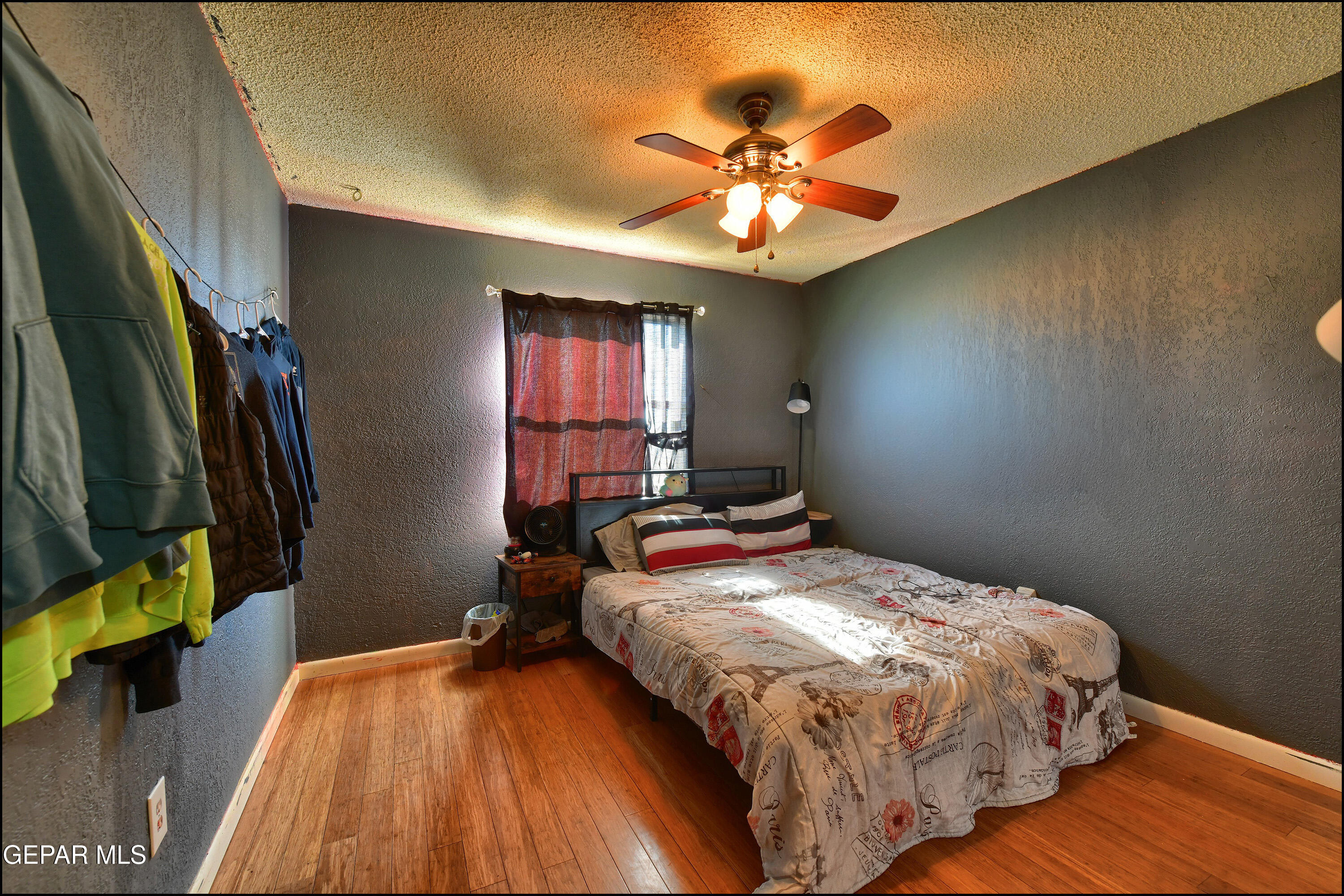395 Gabaldon Road Anthony, NM 88021 - Photo 35 of 84 a bedroom with a bed and a chandelier