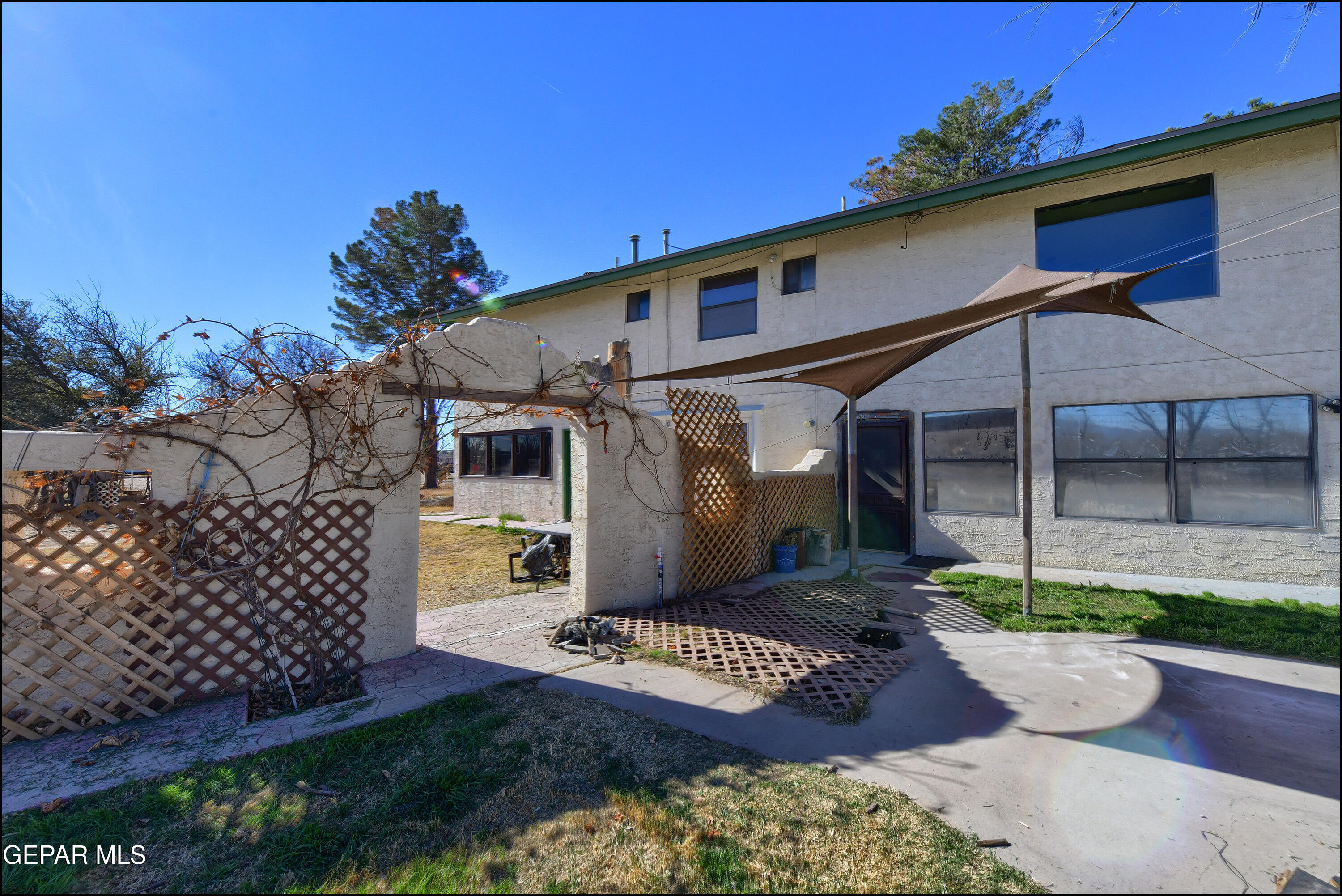395 Gabaldon Road Anthony, NM 88021 - Photo 48 of 84 a front view of a house with a yard