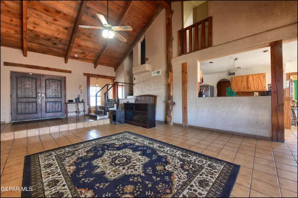 a view of a living room with furniture and a floor to ceiling window