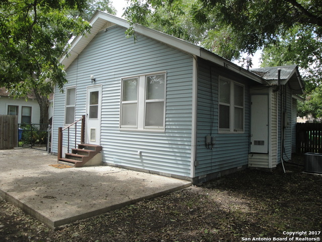615 East Elm Street Seguin, TX 78155 - Photo 17 of 23 a view of a house with a yard and garage