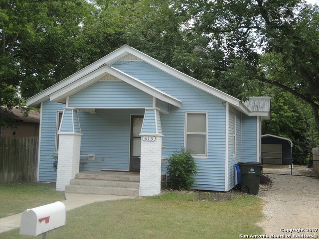 615 East Elm Street Seguin, TX 78155 - Photo 2 of 23 a front view of a house with a garden