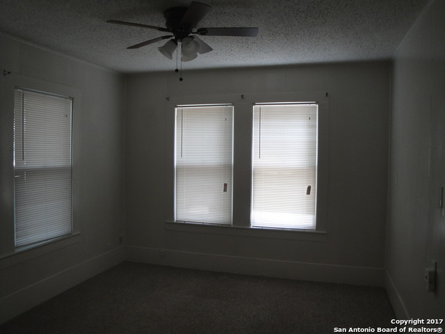 615 East Elm Street Seguin, TX 78155 - Photo 9 of 23 an empty room with a window