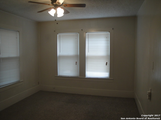 615 East Elm Street Seguin, TX 78155 - Photo 10 of 23 an empty room with a window