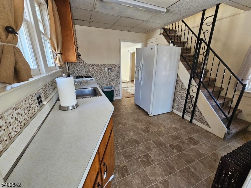 29 Ideal Street Gillette, NJ 07933 - Photo 4 of 25 a bathroom with a granite countertop sink a toilet and a shower