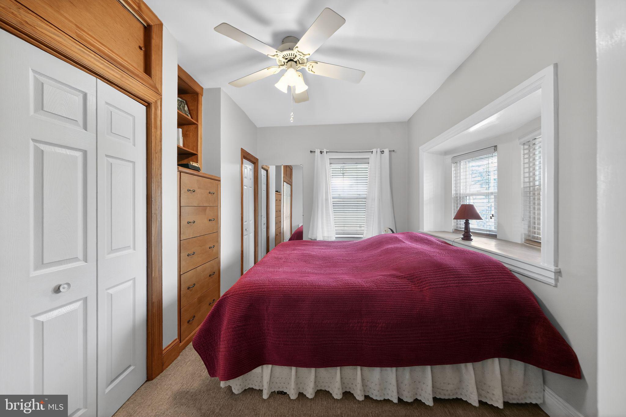 2143 Haig Avenue Morton, PA 19070 - Photo 21 of 29 a bedroom with a bed and a chandelier