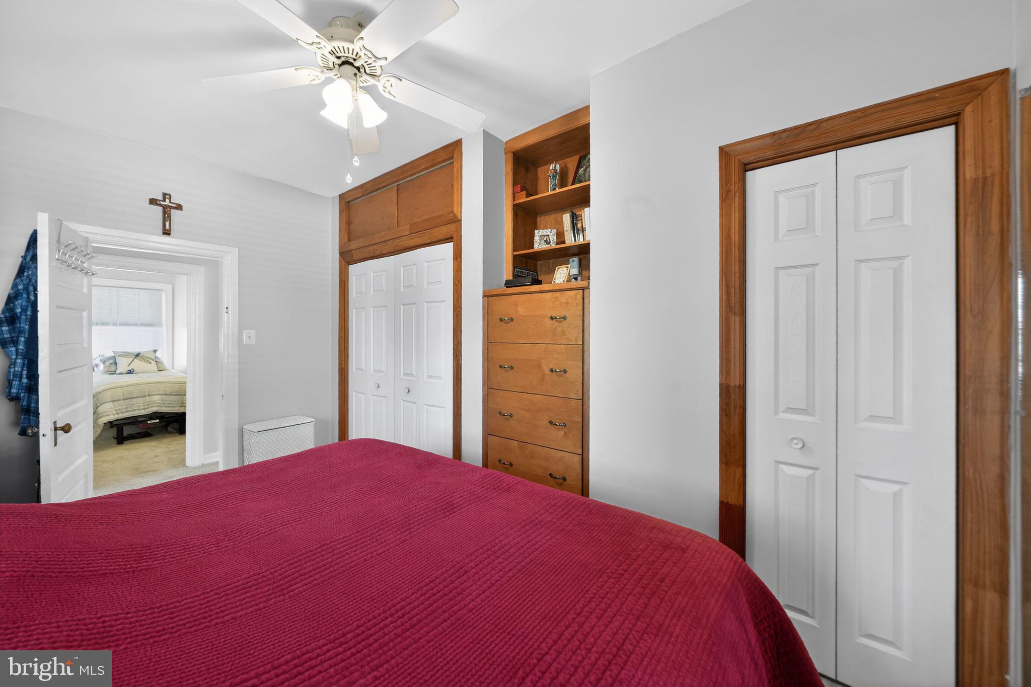 2143 Haig Avenue Morton, PA 19070 - Photo 22 of 29 a bedroom with a bed and a chandelier