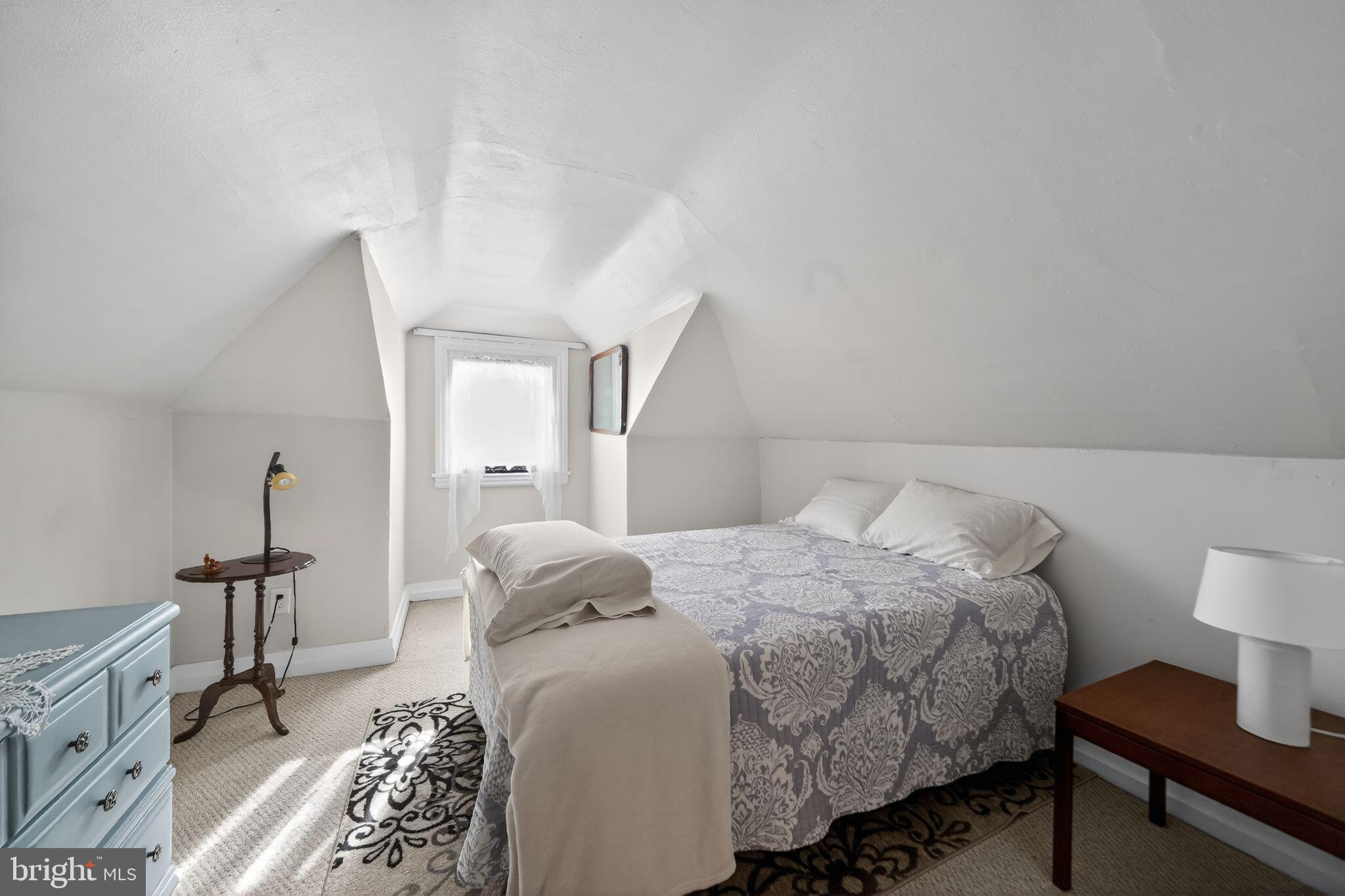 2143 Haig Avenue Morton, PA 19070 - Photo 25 of 29 a bedroom with a bed and a lamp with window