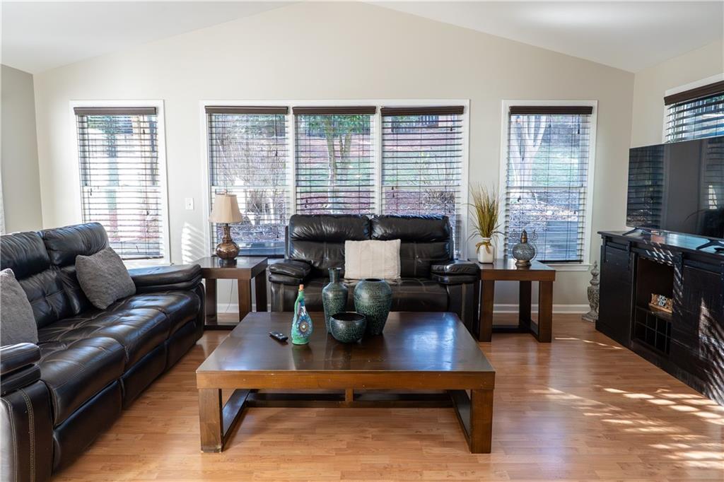 1004 Cavesson Terrace Lawrenceville, GA 30045 - Photo 13 of 48 a living room with furniture and a flat screen tv