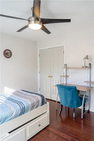 a living room with a bed and a table