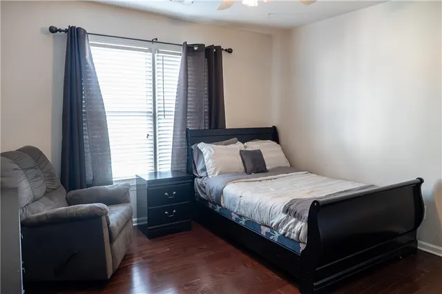 a bedroom with a bed and a couch