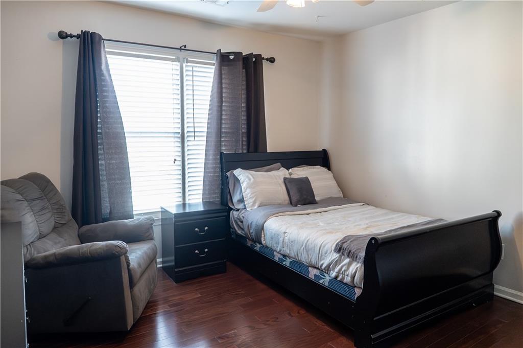 1004 Cavesson Terrace Lawrenceville, GA 30045 - Photo 25 of 48 a bedroom with a bed and a couch