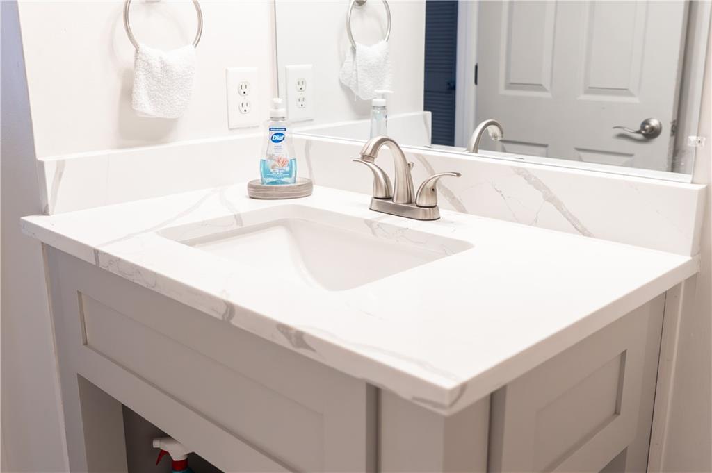 1004 Cavesson Terrace Lawrenceville, GA 30045 - Photo 27 of 48 a bathroom with a sink and a mirror