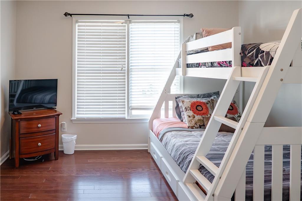 1004 Cavesson Terrace Lawrenceville, GA 30045 - Photo 29 of 48 a living room with furniture and a flat screen tv