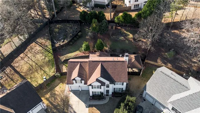 an aerial view of residential houses with outdoor space