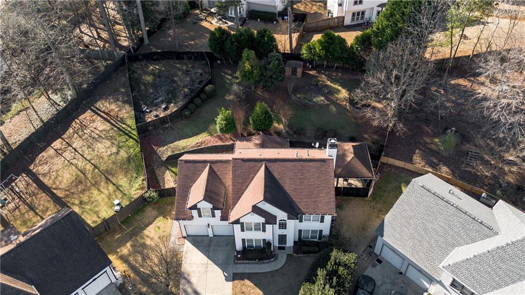 1004 Cavesson Terrace Lawrenceville, GA 30045 - Photo 3 of 48 an aerial view of residential houses with outdoor space
