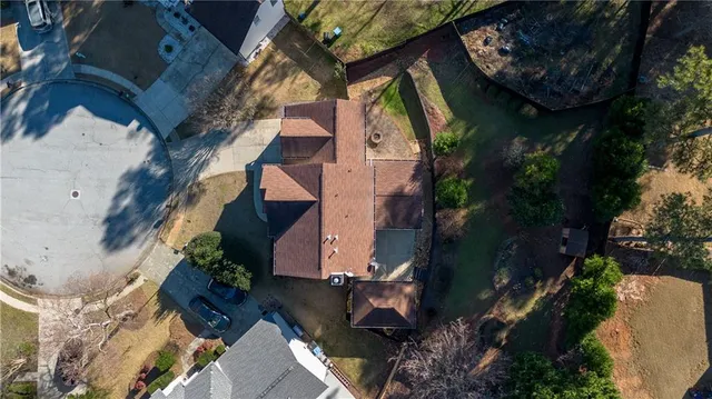 an aerial view of house with yard