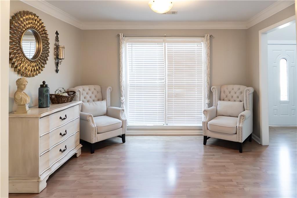 1004 Cavesson Terrace Lawrenceville, GA 30045 - Photo 7 of 48 a living room with furniture and a large window