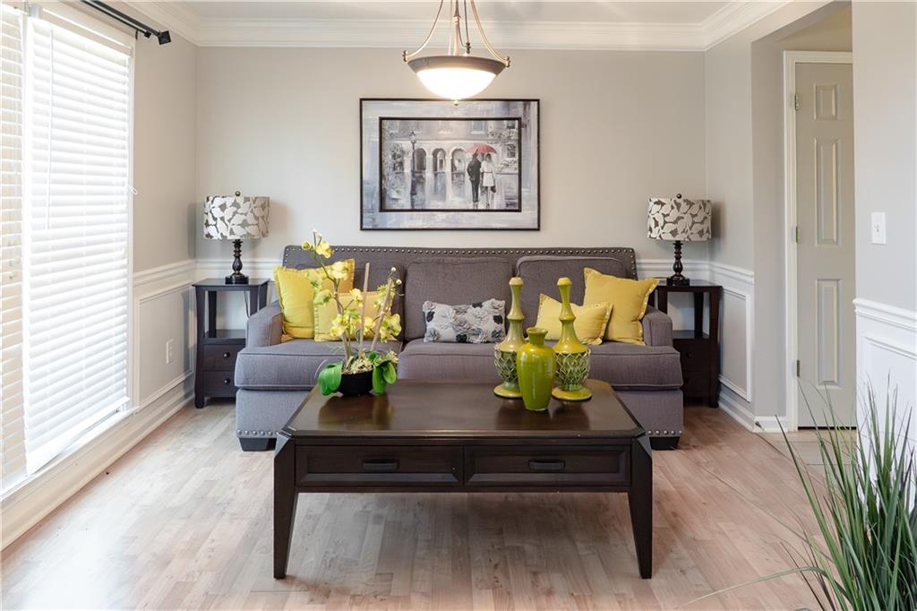 1004 Cavesson Terrace Lawrenceville, GA 30045 - Photo 9 of 48 a living room with furniture and wooden floor