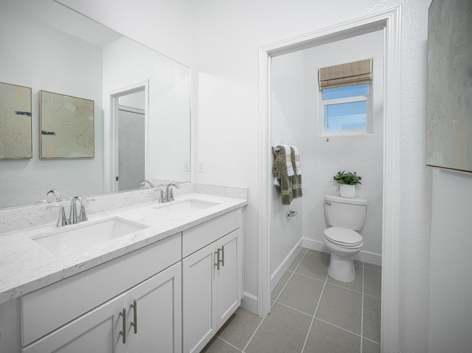 6708 Kaweah Lane Stockton, CA 95219 - Photo 14 of 21 a bathroom with a granite countertop toilet sink and mirror