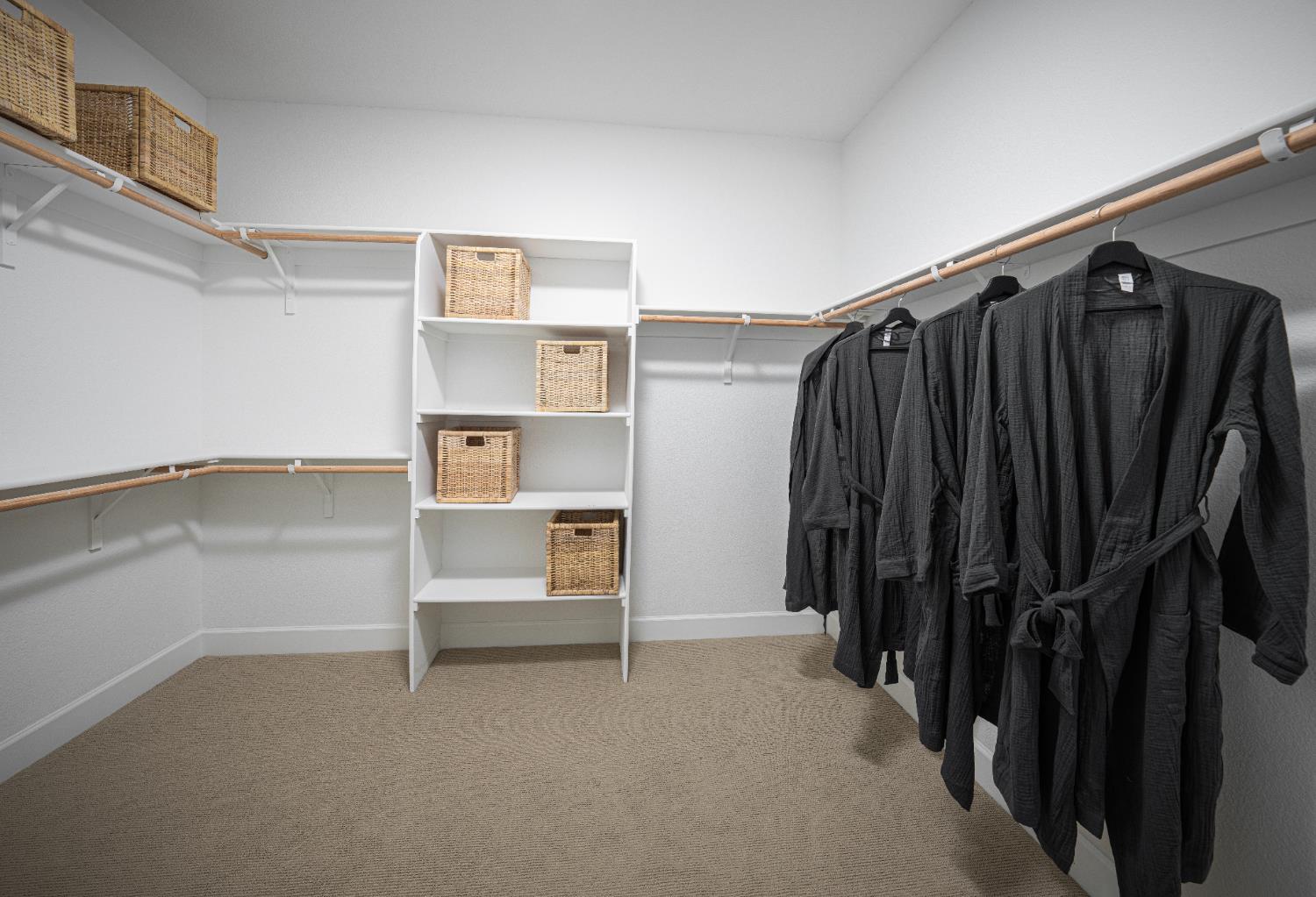 6708 Kaweah Lane Stockton, CA 95219 - Photo 8 of 21 a view of walk in closet with clothes and shoes