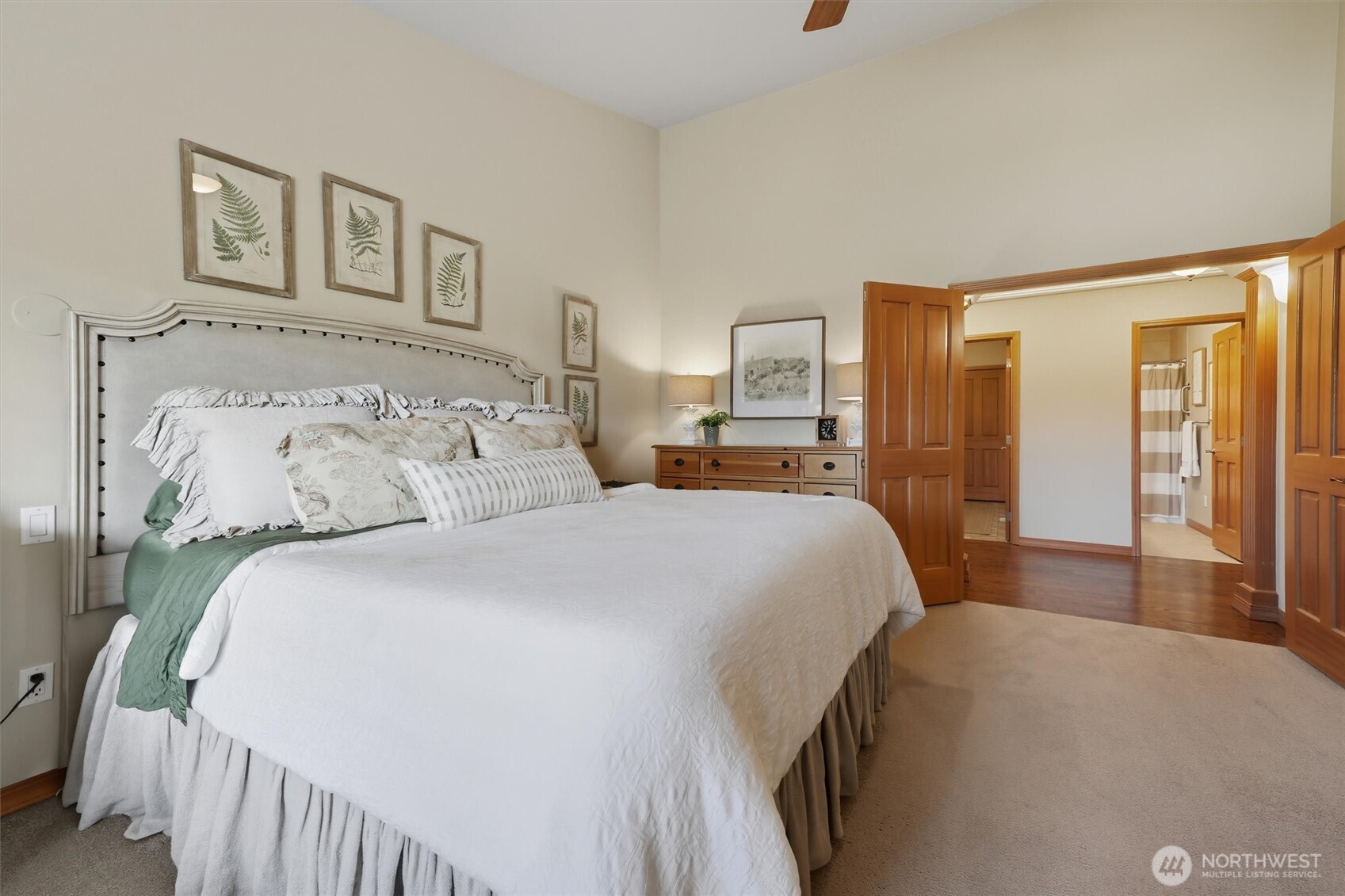20615 39th Avenue Southeast Bothell, WA 98021 - Photo 20 of 36 a bedroom with a large bed and a chandelier