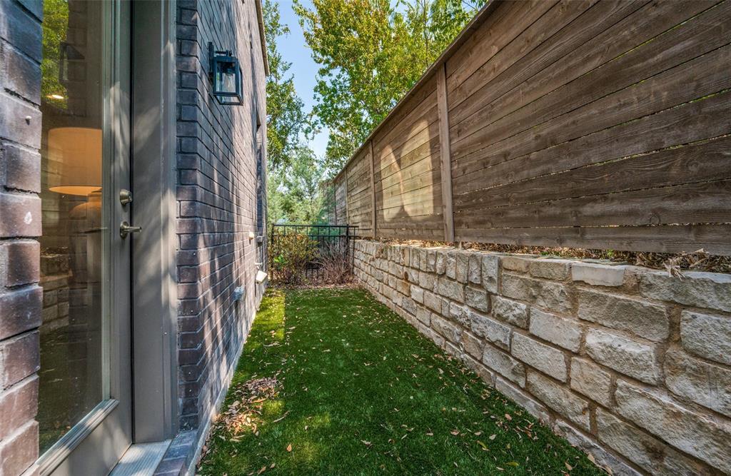 9142 Prado Lane Dallas, TX 75220 - Photo 21 of 21 a view of a pathway of a brick house with a small yard