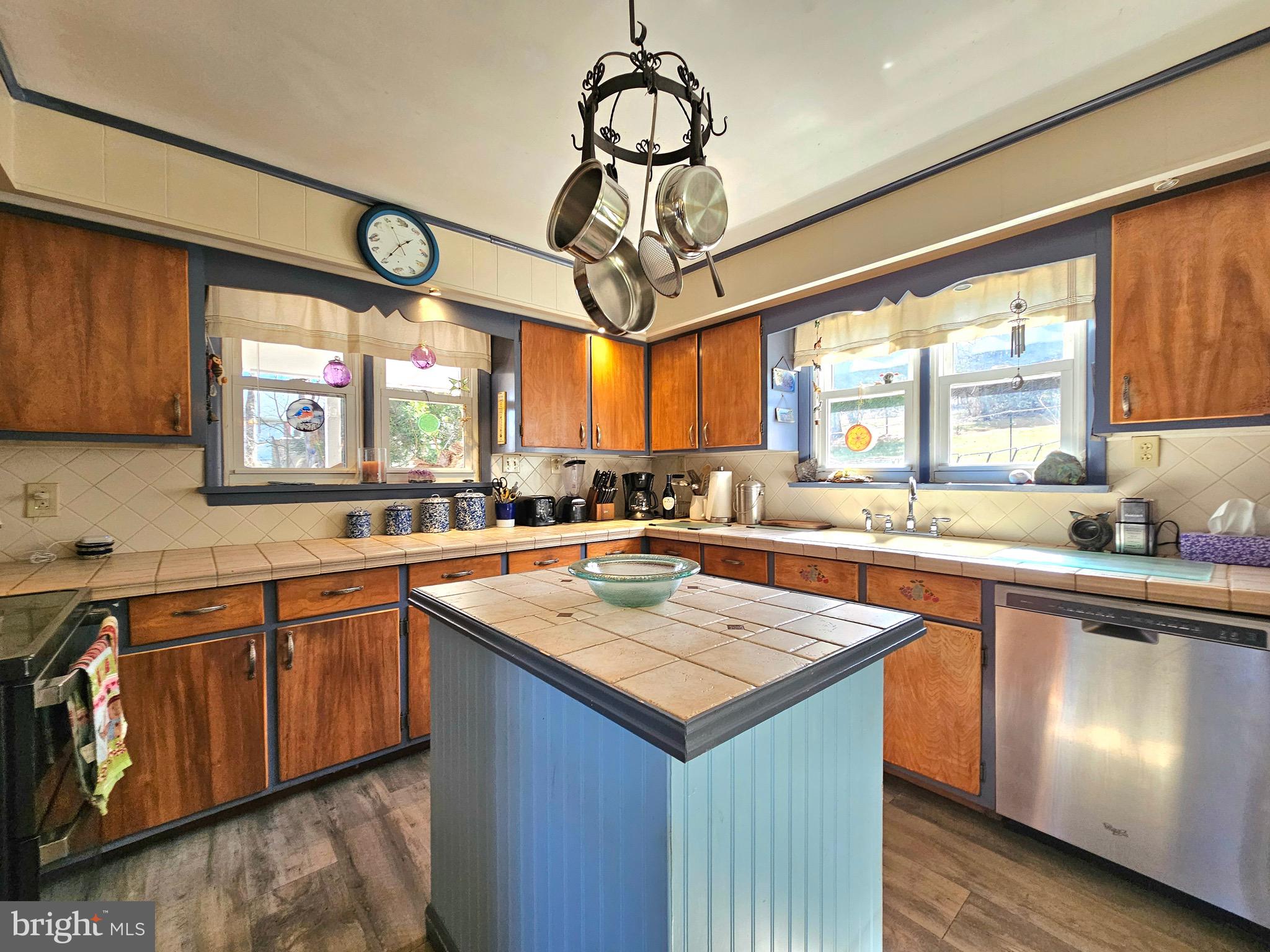 205 Valley View Road Hellertown, PA 18055 - Photo 12 of 27 a kitchen with a large island in the center windows and a sink
