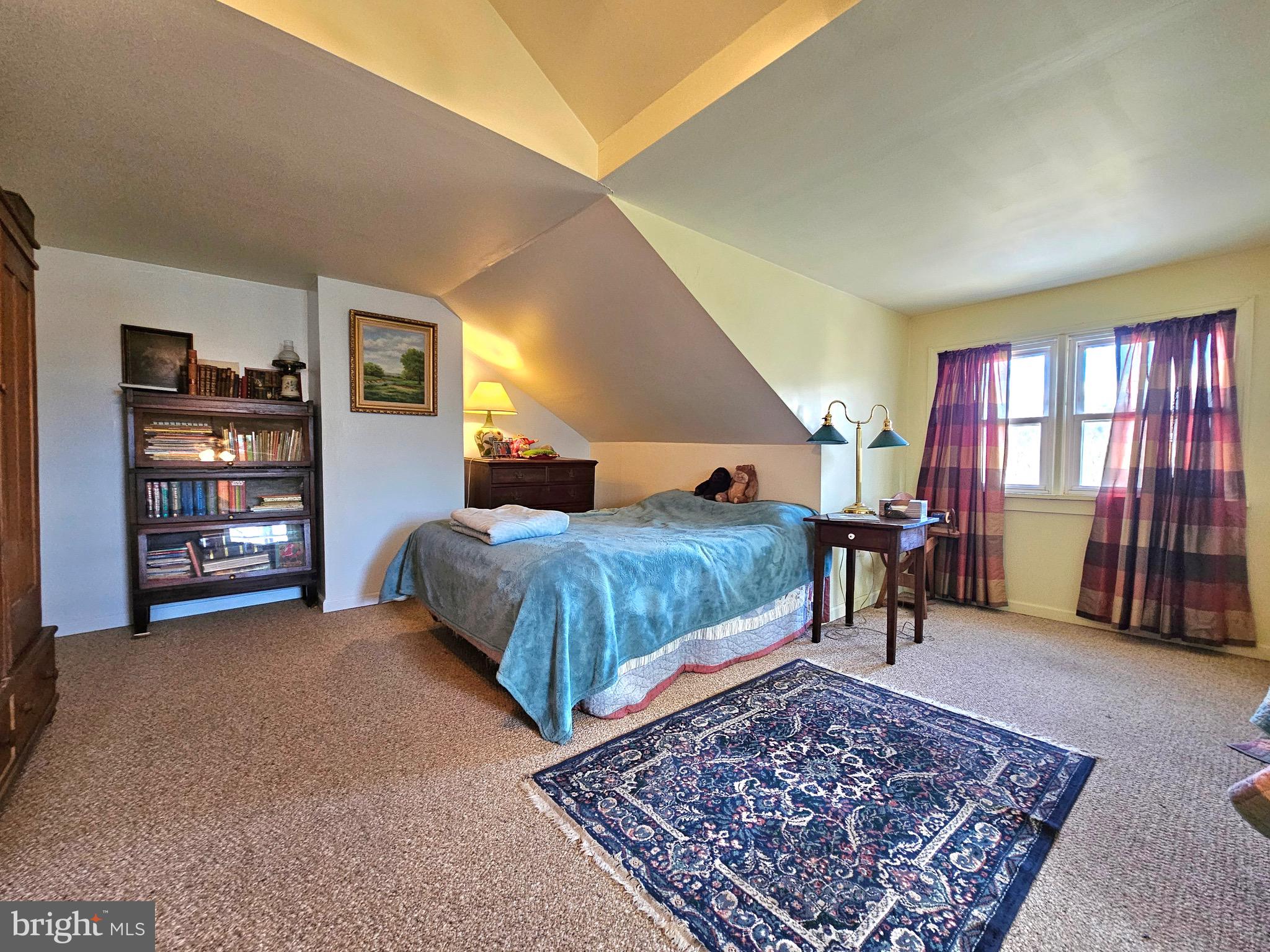 205 Valley View Road Hellertown, PA 18055 - Photo 21 of 27 a bedroom with a bed a dresser and a bookshelf