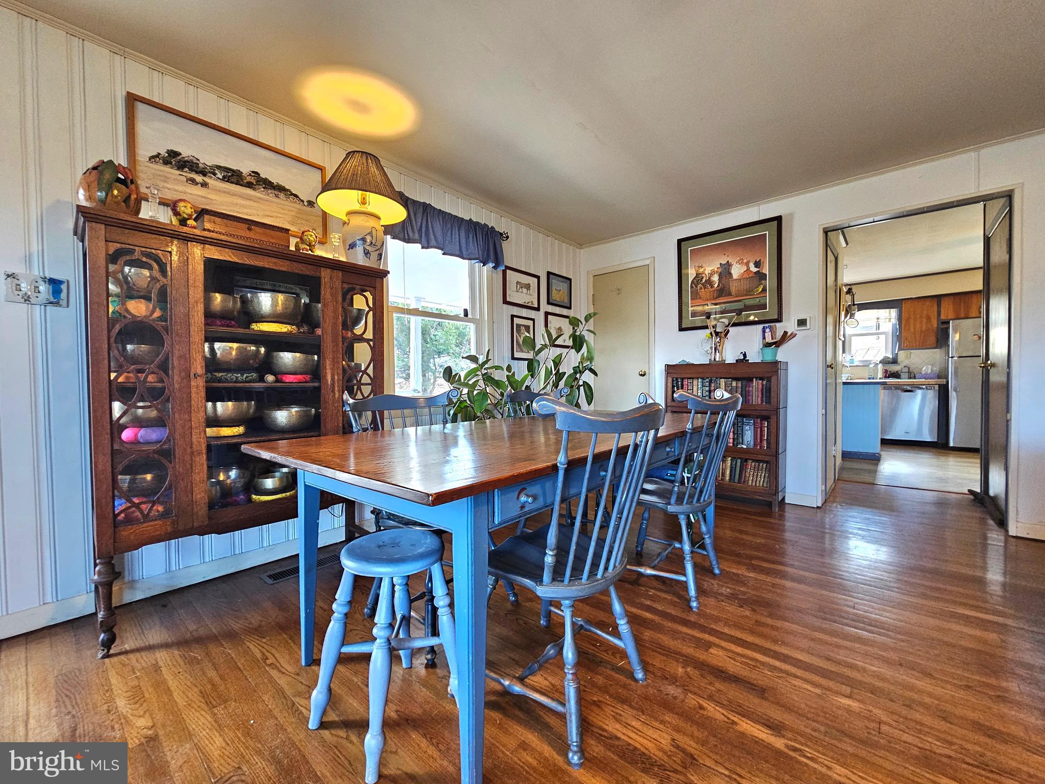 205 Valley View Road Hellertown, PA 18055 - Photo 3 of 27 a dining room with wooden floor a chandelier a wooden table and chairs