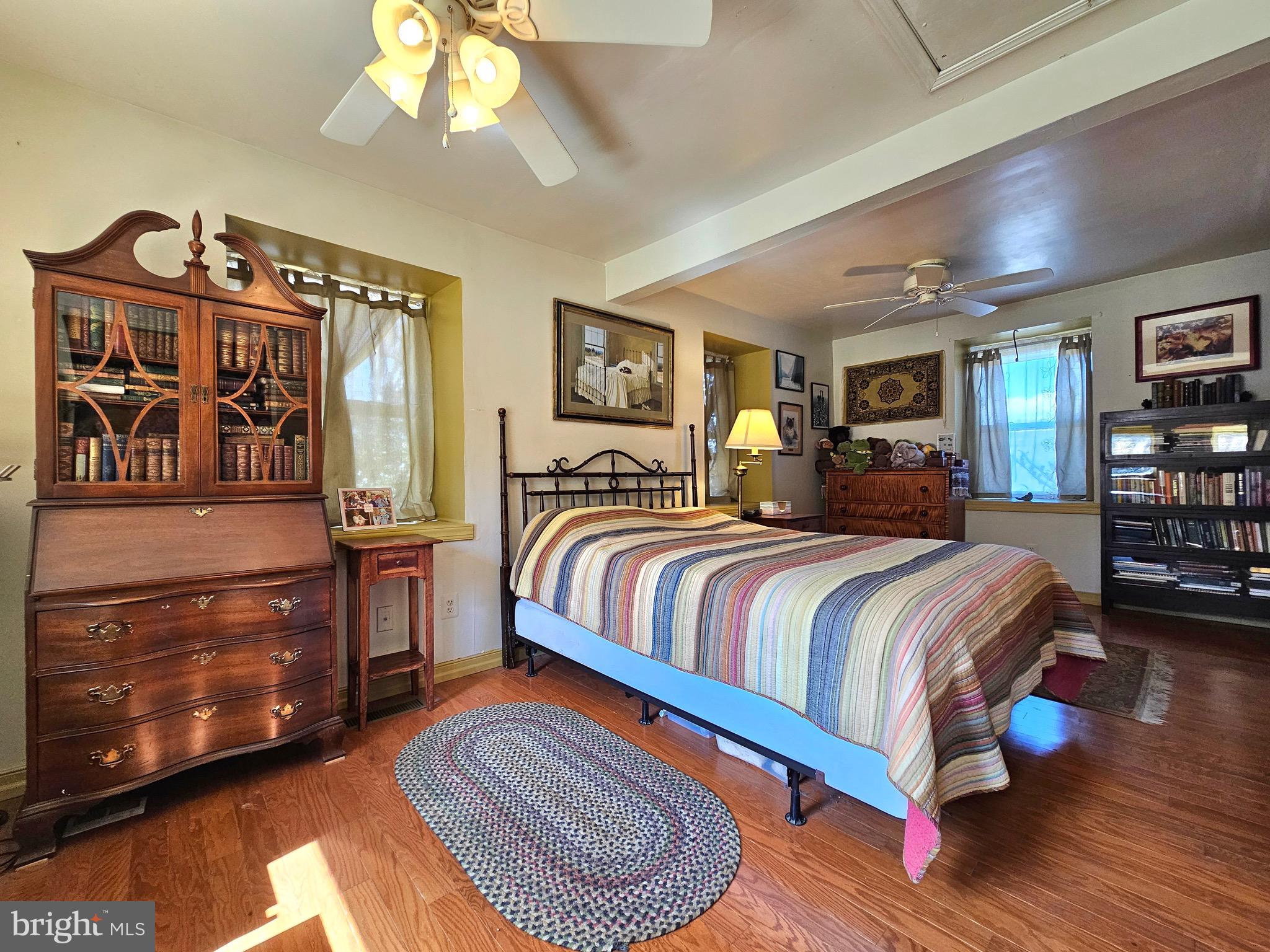 205 Valley View Road Hellertown, PA 18055 - Photo 7 of 27 a bedroom with a bed a dresser and book shelf