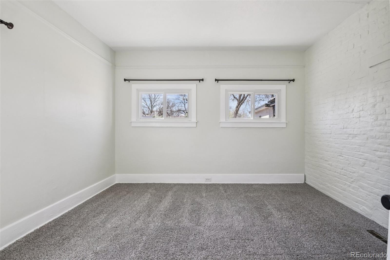 2715 Cook Street Denver, CO 80205 - Photo 15 of 30 an empty room with a window