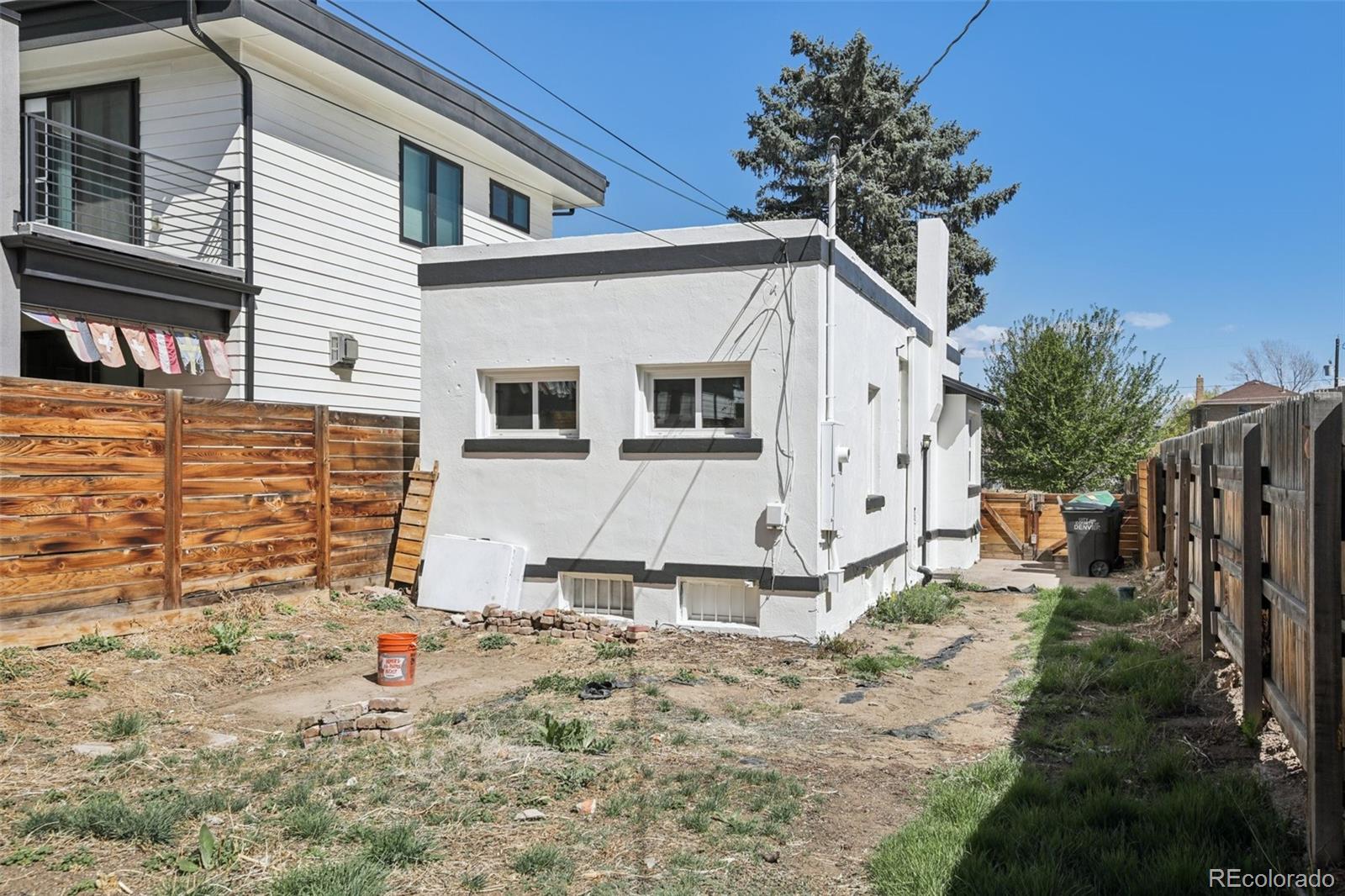 2715 Cook Street Denver, CO 80205 - Photo 26 of 30 a view of a house with wooden fence