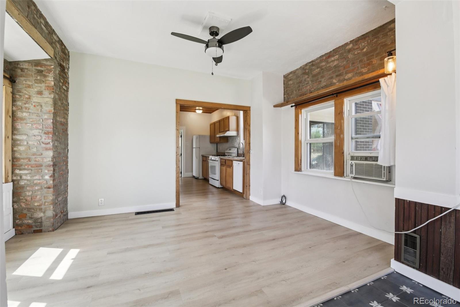 2715 Cook Street Denver, CO 80205 - Photo 5 of 30 an empty room with windows and closet