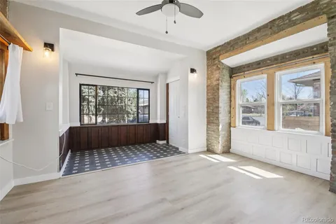 a living room with a large bed and a large window