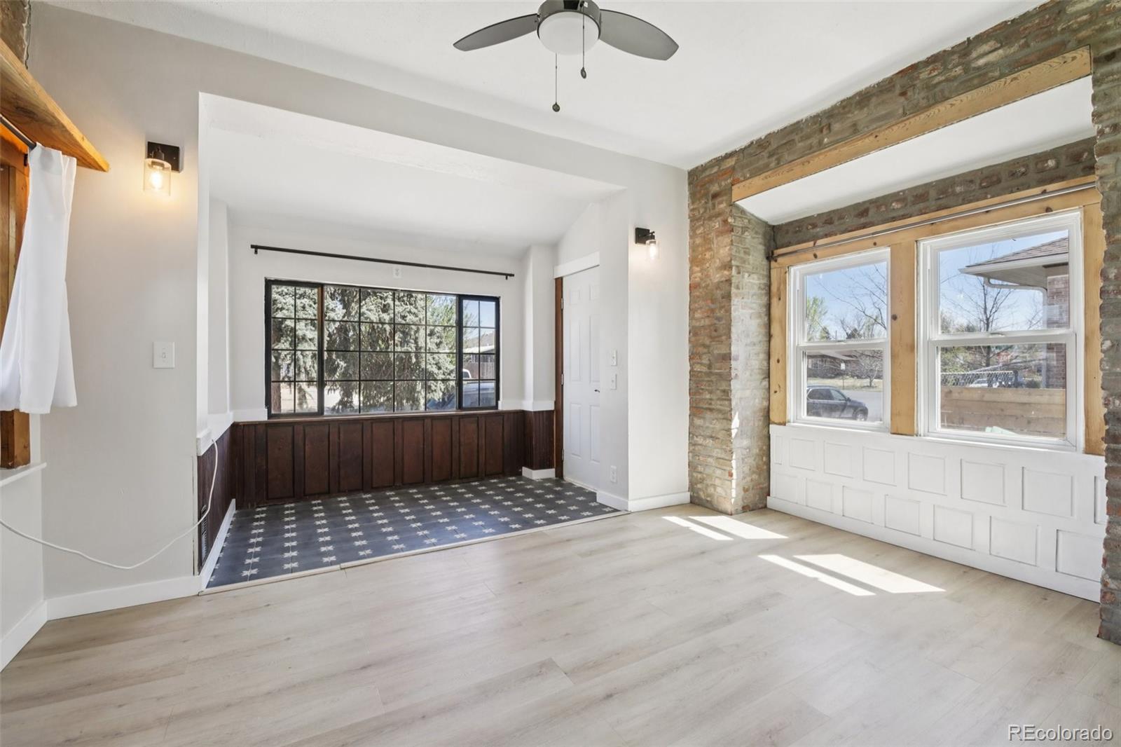 2715 Cook Street Denver, CO 80205 - Photo 7 of 30 a living room with a large bed and a large window