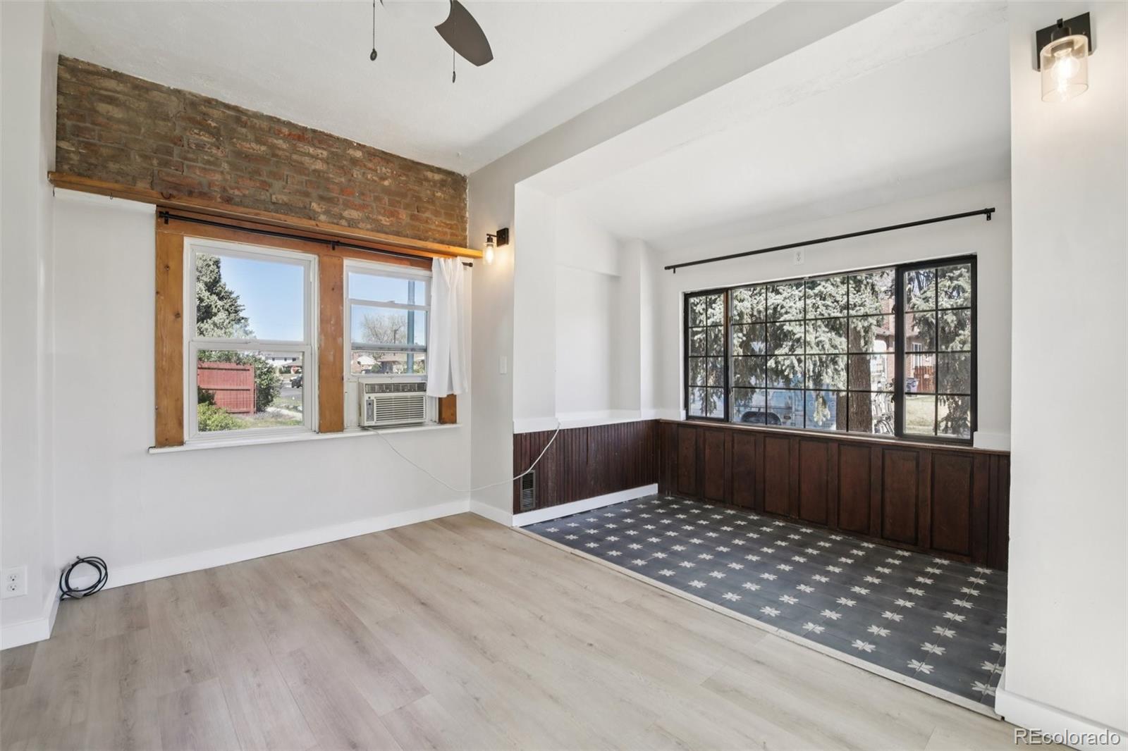 2715 Cook Street Denver, CO 80205 - Photo 8 of 30 an empty room with windows