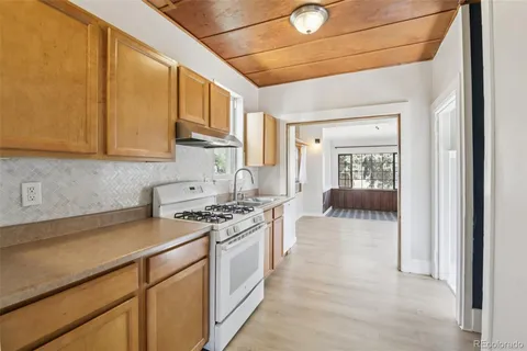 a kitchen with stainless steel appliances granite countertop a stove and a sink