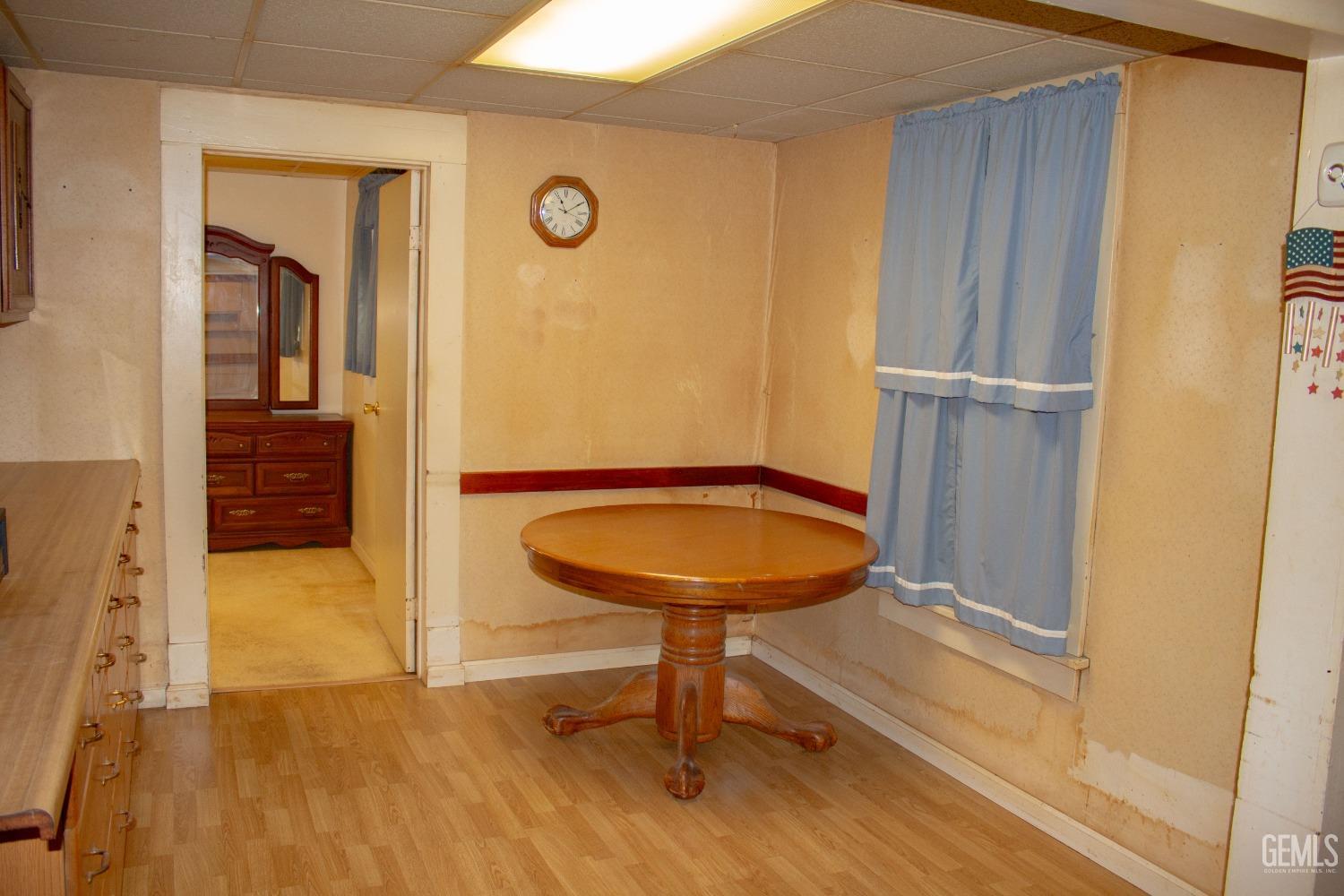 Undisclosed Address Bakersfield, CA 93307 - Photo 14 of 29 a view of a livingroom with furniture and wooden floor