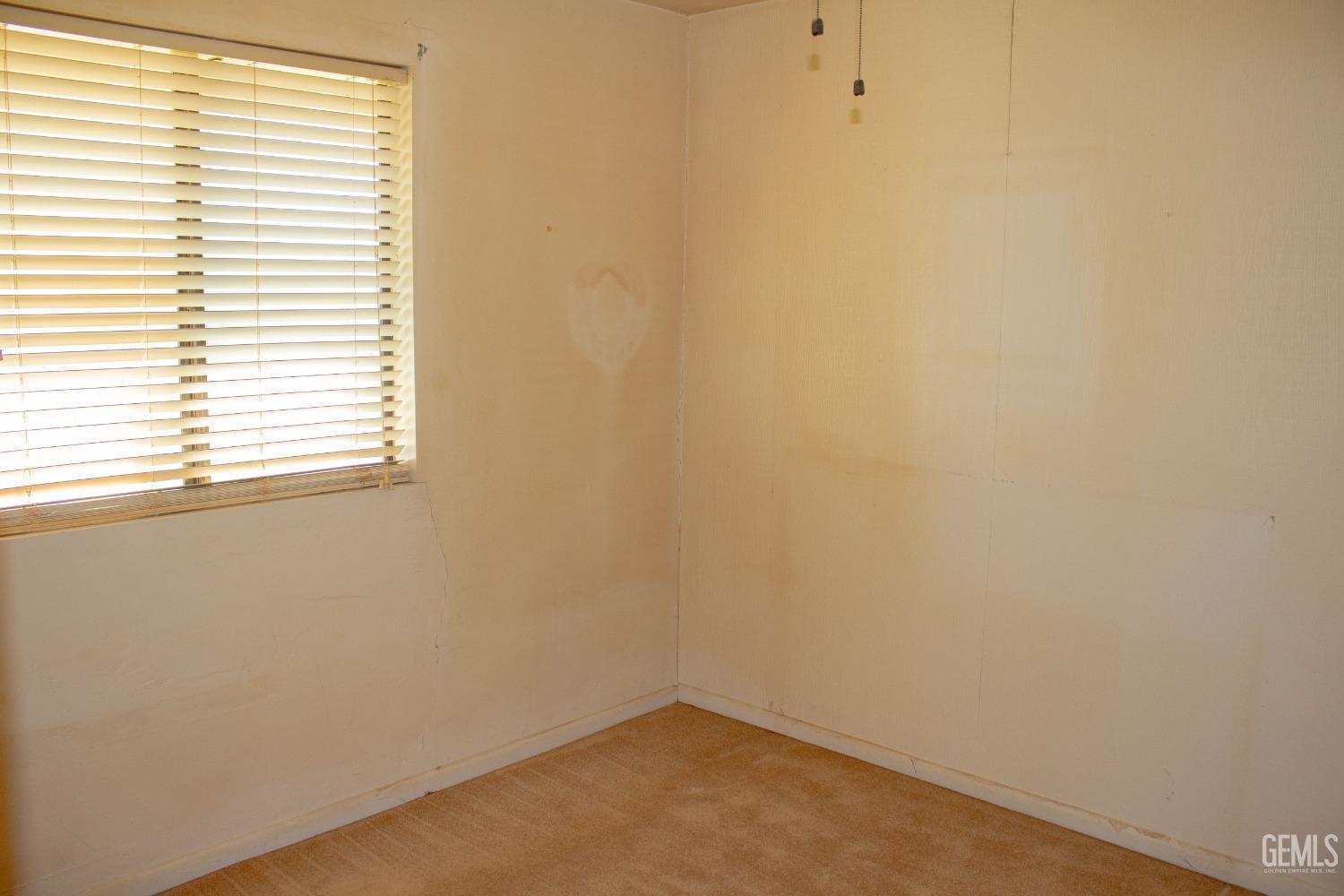 Undisclosed Address Bakersfield, CA 93307 - Photo 9 of 29 an empty room with a window