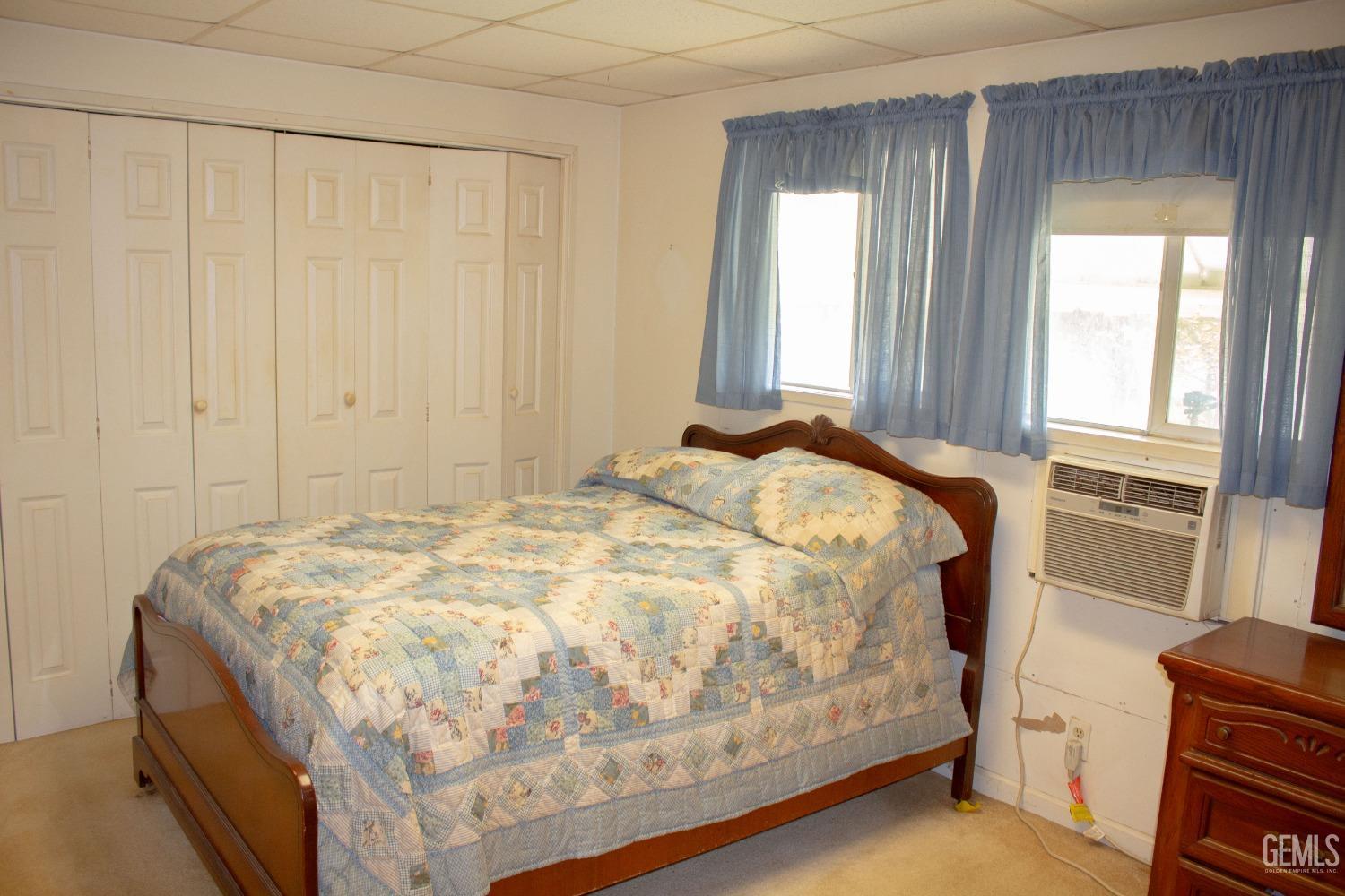 Undisclosed Address Bakersfield, CA 93307 - Photo 10 of 29 a bed sitting in a bedroom next to a window