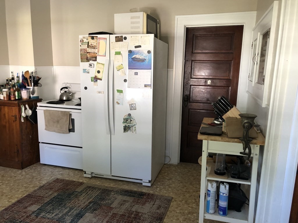 10 Worcester Avenue Montague, MA 01376 - Photo 6 of 35 a kitchen with a refrigerator and cabinets