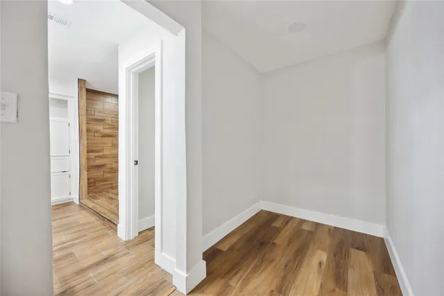 a view of a large window with yard in front of house
