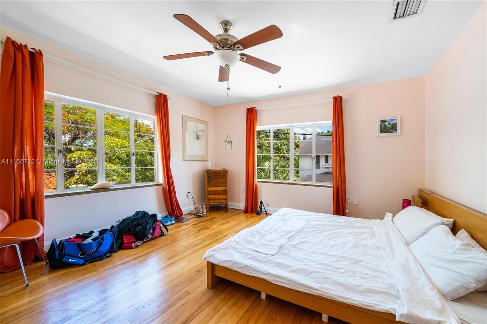 635 Northeast 68th Street Miami, FL 33138 - Photo 11 of 14 a bed sitting in a bedroom next to a window