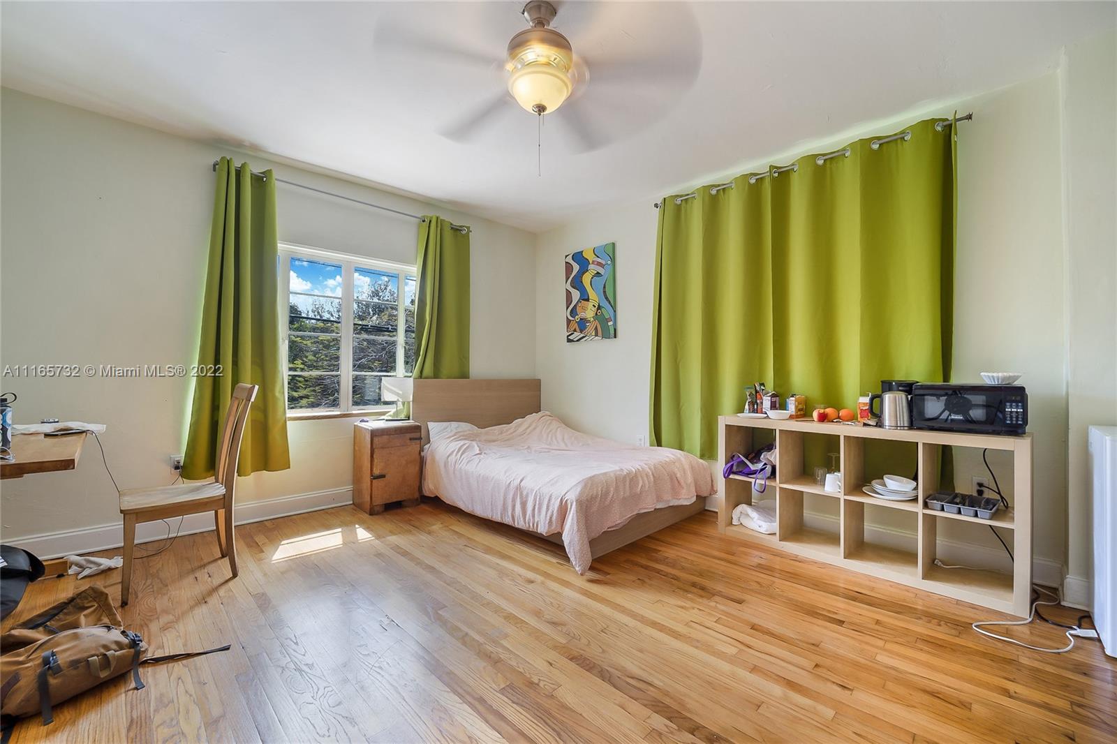 635 Northeast 68th Street Miami, FL 33138 - Photo 13 of 14 a bed room with a bed and a window