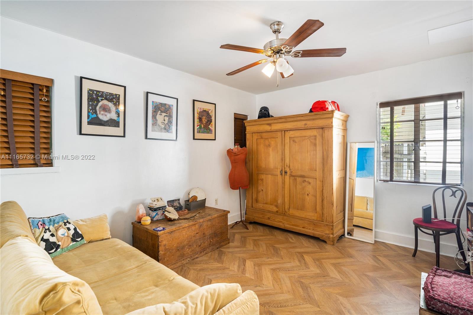 635 Northeast 68th Street Miami, FL 33138 - Photo 5 of 14 a living room with furniture and a window