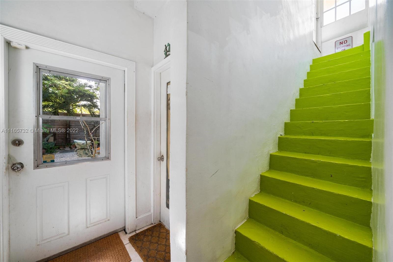 635 Northeast 68th Street Miami, FL 33138 - Photo 7 of 14 a view of stairs and a window