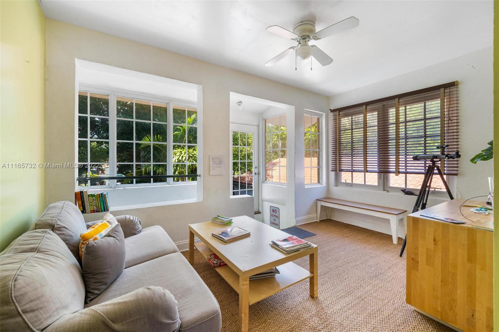 635 Northeast 68th Street Miami, FL 33138 - Photo 8 of 14 a living room with furniture and a large window